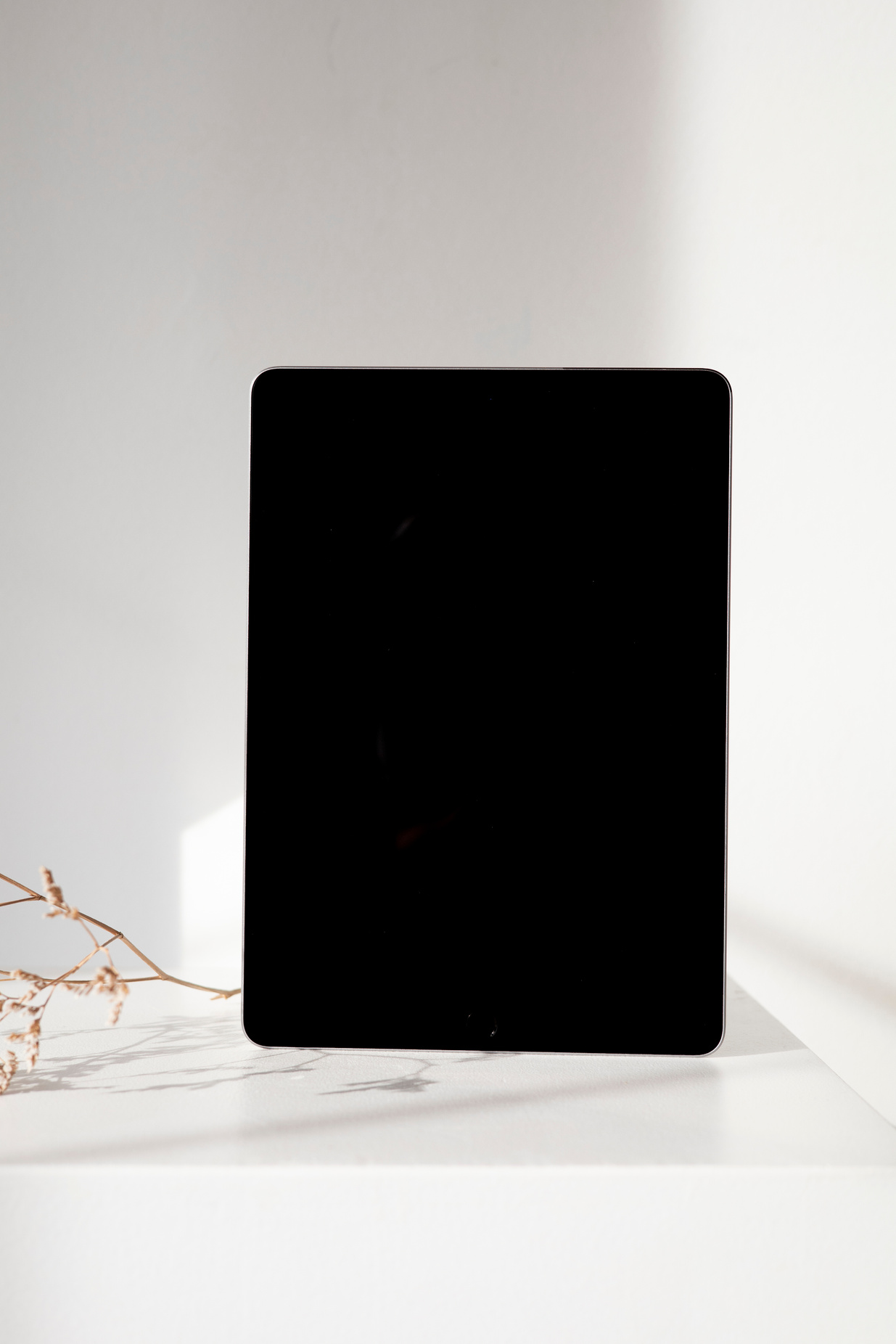 Black Ipad on White Table